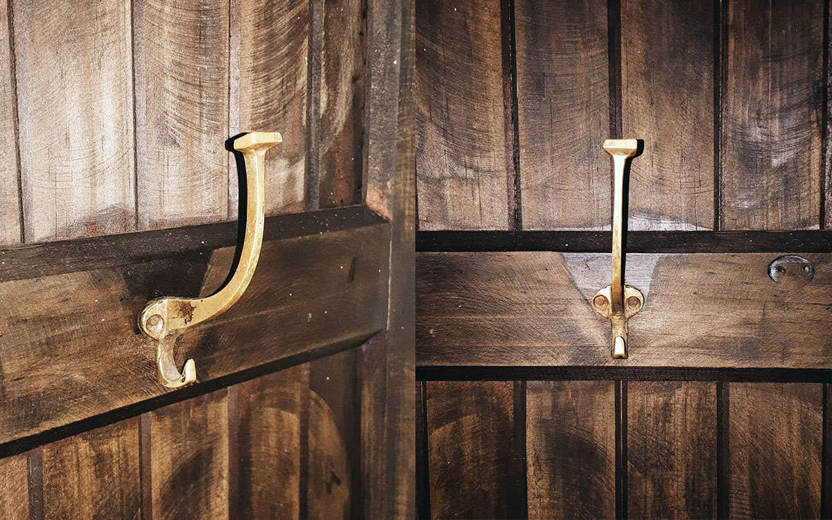 A double hook made of metal, brass, nailed to a door. Found on a private home in Valle de Bravo, Mexico, 2020.