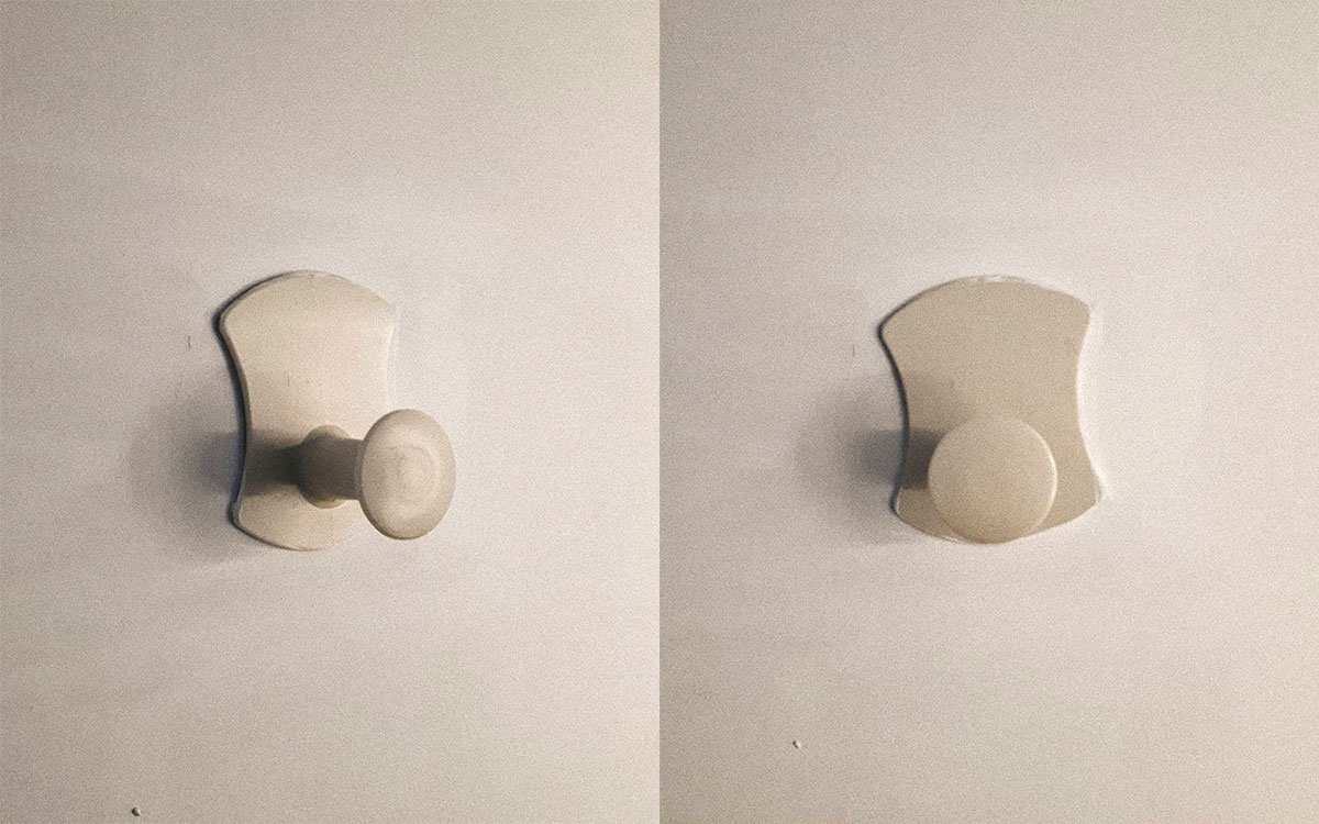 A single hook made of beige plastic, fixed to a door. Found on a private home in Lyon, France, 2020.