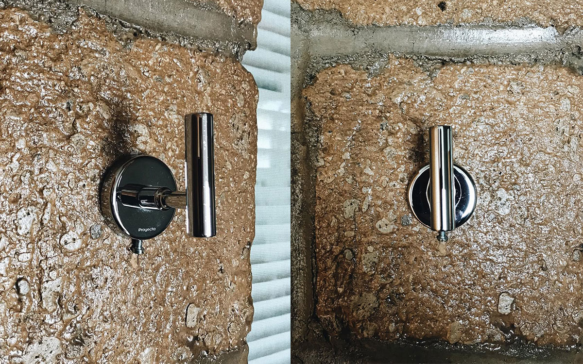 A single hook made of metal, chrome, screwed to a wall. Found on a private home in Aguascalientes, Mexico, 2022.