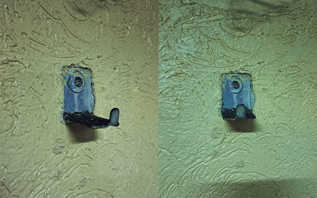 A single hook made of metal, gray paint, screwed to a wall. Found on a restaurant in Mexico City, Mexico, 2023.