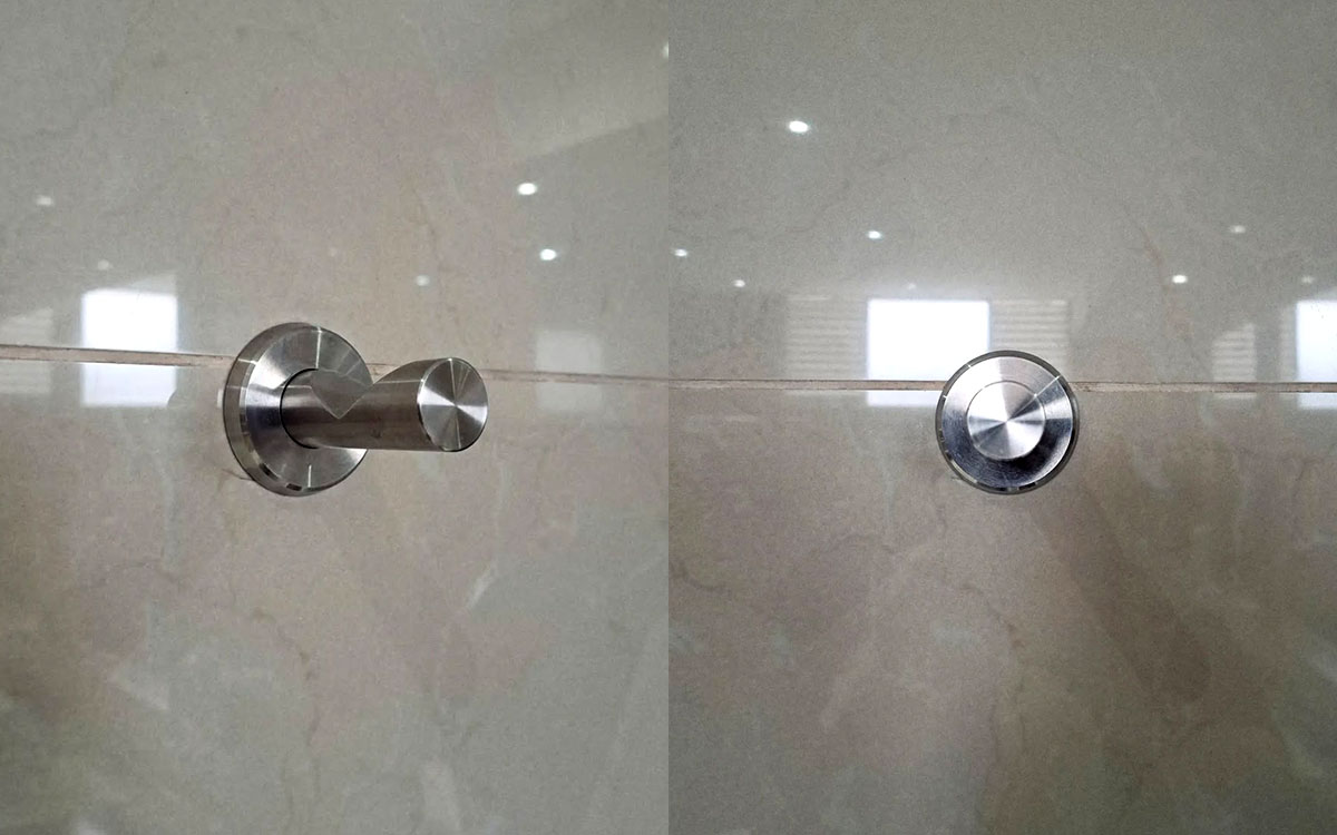 A single hook made of metal, nickel, screwed to a wall. Found at Club Mundet in Mexico City, Mexico, 2024.