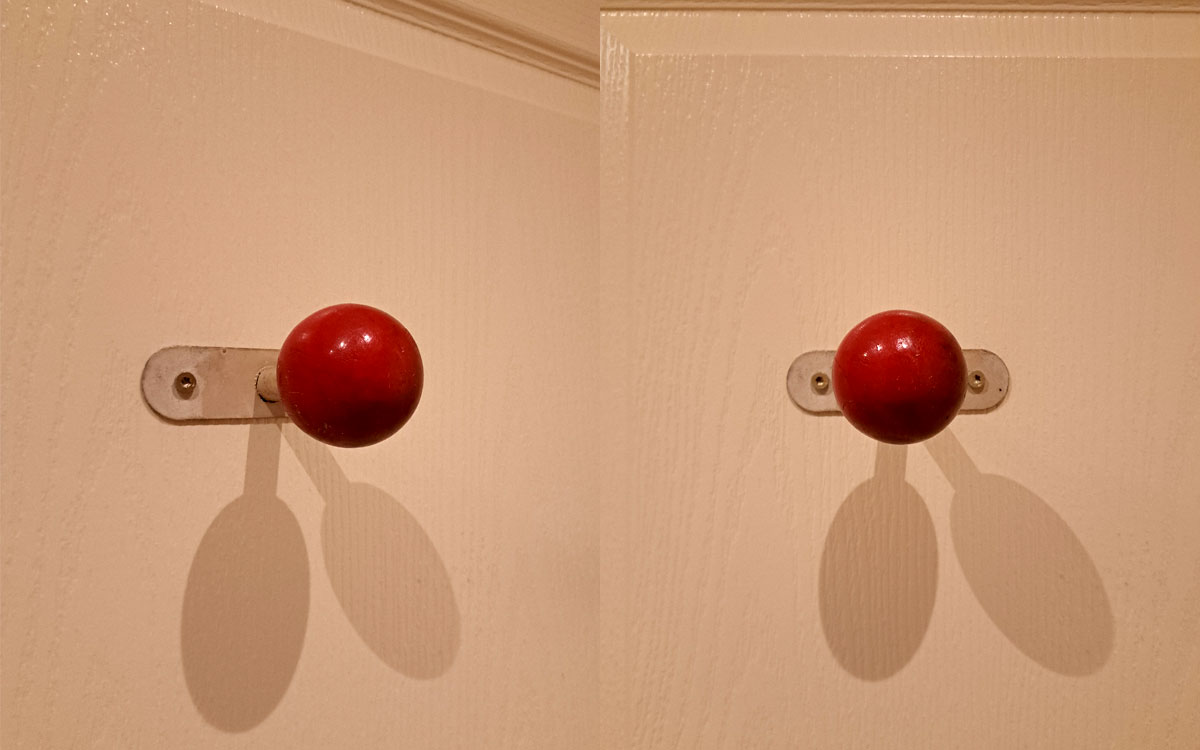 A single hook made of metal and wood, paint, screwed to a wall. Found on a hotel in Arles, France, 2025.