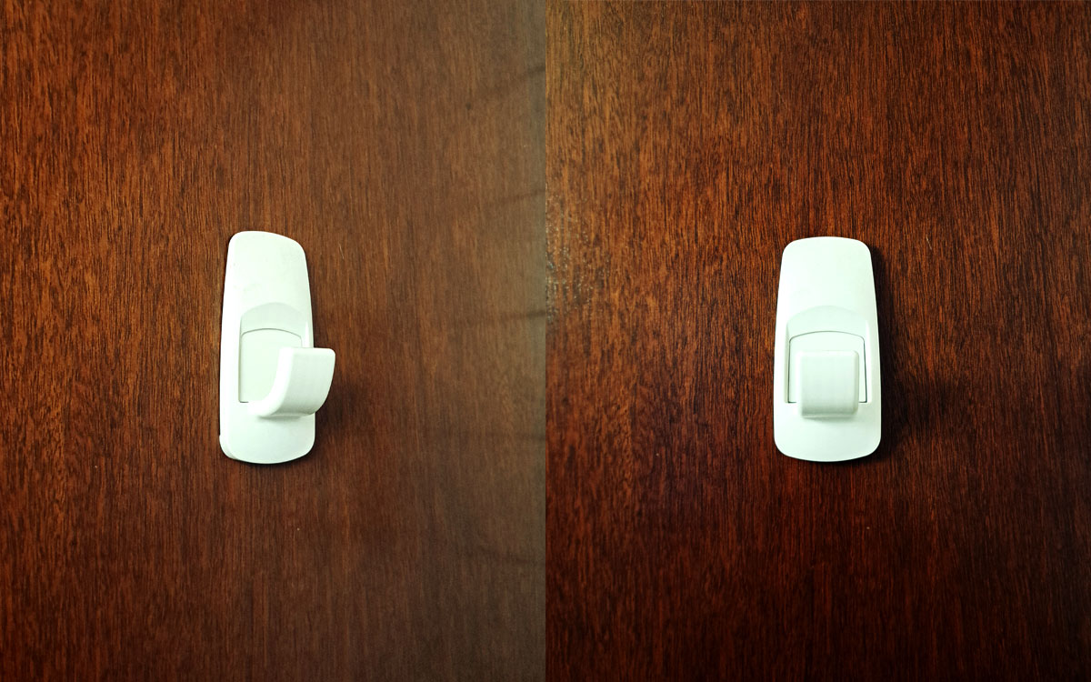 A single hook made of white plastic, screwed to a door. Found on a home in Mexico City, Mexico, 2025.